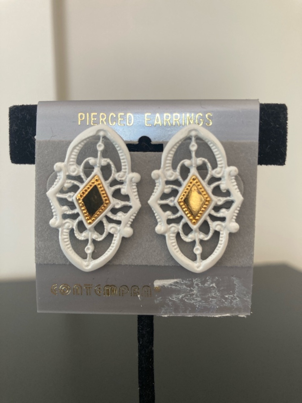 White Filigree Oval Earrings with Gold Diamond Accent